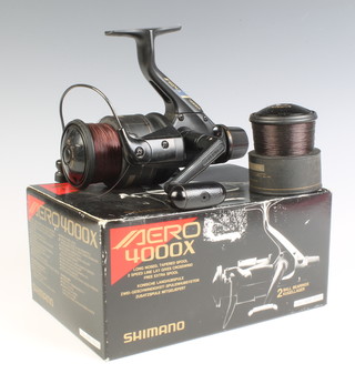 An Aero 400X fishing reel boxed and complete with paper work 