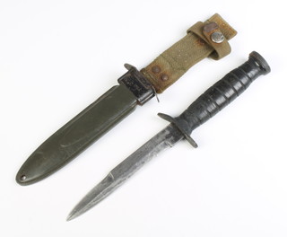 An American M3 fighting knife,the 15cm marked US M3 contained in an associated scabbard marked USM8A1 