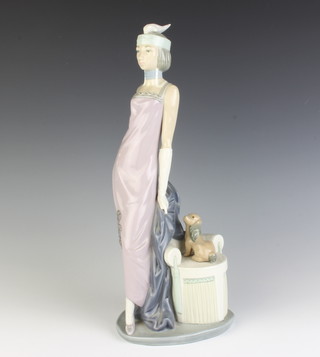 A Lladro figure of a lady standing beside a chair with a puppy 33cm 