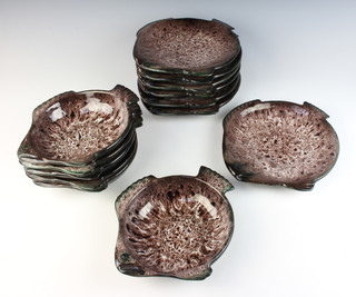 Eight Marius Giuge Vallauris brown glazed earthenware fish plates and seven ditto bowls 