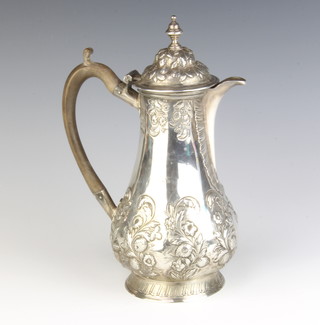 A Georgian repousse silver coffee pot decorated flowers with fruitwood handle,  gross 624gr