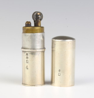 A cylindrical silver cigarette lighter London 1944 6cm