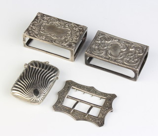 A silver match box holder one other and a plated vesta
