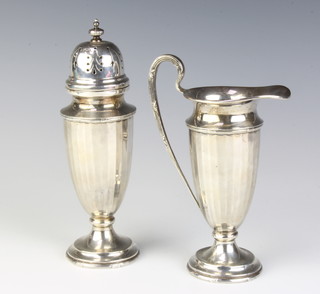 A panelled silver cream jug and sugar shaker Sheffield 1927, 318 grams