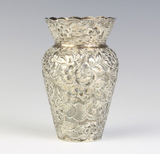 An 800 standard repousse silver vase decorated with flowers 114 grams 10cm