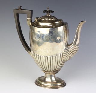 An Edwardian silver demi-fluted coffee pot with ebony mounts Sheffield 1903, Maker Walker & Hall gross weight 773 grams 