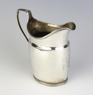 A George III silver cream jug of plain form with chased monogram London 1796, 128 grams