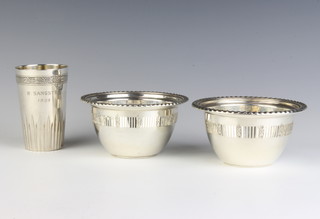A pair of pierced sterling silver bowls by Birks and a Continental beaker 246 grams 