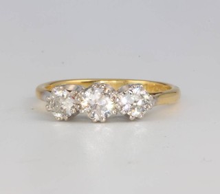 An 18ct and yellow gold 3 stone diamond ring approx 0.9ct, size M 