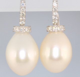 A pair of 18ct white gold cultured fresh water pearl and diamond earrings, approx. 0.4ct 