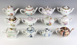 Twelve Franklin Mint Victorian and Albert Collection reproduction miniature teapots