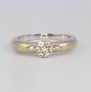 A 14ct white gold diamond cluster ring size P 1/2