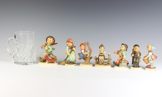 Seven Hummel figures - Little Helper 73 11cm, Merry Wanderer 112/0 10cm, Chimney Sweep 122/0 9cm, Apple Tree Girl 1413/0 10cm, Little Sweeper 171 11cm, Strolling Along 5 12cm and Boy on a Gate 1113/0 8cm 