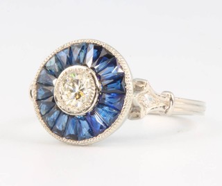 A platinum diamond and sapphire target ring size N 
