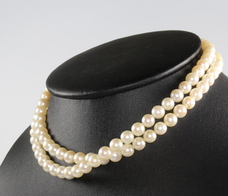 A string of cultured pearls with a 9ct yellow gold clasp 70cm 