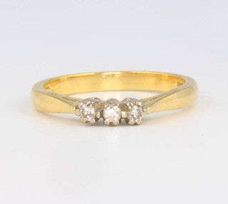 An 18ct yellow gold 3 stone diamond ring size Q 