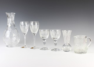 A Royal Brierley fuchsia cascade carafe and 2 ditto wine glasses, a Royal Brierley honeysuckle jug and 2 wine glasses together with a vase 