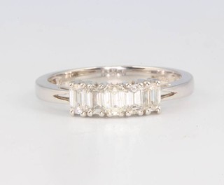 An 18ct white gold 5 stone baguette cut diamond ring 0.78ct, size M 