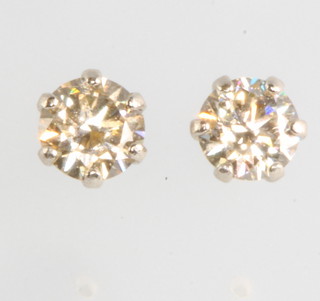 A pair of platinum and diamond ear studs approx. 0.3ct 