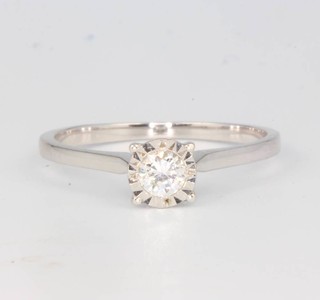 An 18ct white gold single stone diamond ring approx. 0.21ct, size O 1/2
