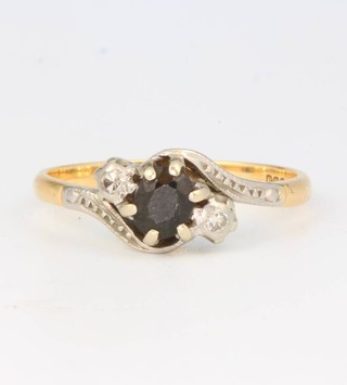 An 18ct yellow gold sapphire and diamond ring size P 1/2