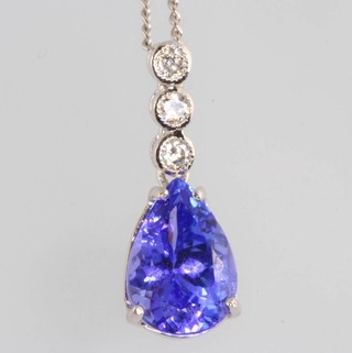 An 18ct white gold tanzanite and diamond pendant the pear cut stone approx. 1.8ct with 3 brilliant cut diamonds approx. 0.12ct on a 9ct white gold chain 
