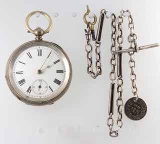 A silver cased keywind pocket watch on a ditto chain 