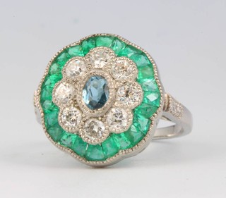 A platinum, diamond, emerald and aquamarine cluster ring size N 
