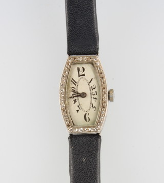 A lady's Art Deco platinum and diamond tonneau shaped wristwatch 