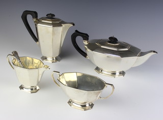 An Art Deco 4 piece silver tea and coffee set with ebony mounts, Sheffield 1933, Maker Frank Cobb & CO Ltd 1937 and 1939, gross weight 1550 grams