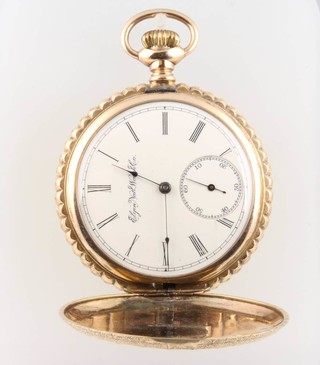 A gold plated hunter pocket watch decorated with a bird the dial inscribed Elgin National Watch Co. 