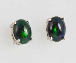 A pair of Ethiopian black opal ear studs 