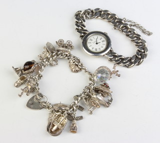 A silver charm bracelet and a ditto watch 