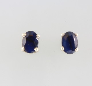 A pair of silver sapphire ear studs 