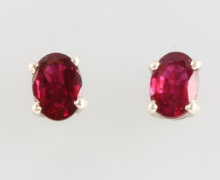 A pair of silver ruby ear studs 