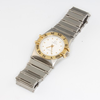 A lady's steel cased Omega Constellation wristwatch on a ditto bracelet in original box 
