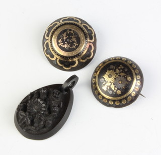 Two Victorian tortoiseshell and piquet brooches and a jet pendant 