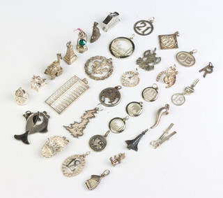 A quantity of silver charms