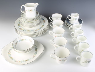 A set of 6 Wedgwood Susie Cooper coffee cans and saucers decorated with flowers and a Royal Doulton Pastoral part tea and dinner service