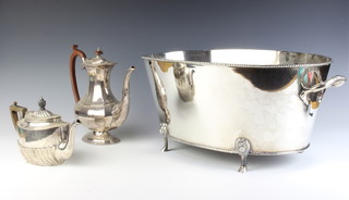 A silver plated 2 handled wine cooler on paw feet 53cm, teapot and coffee pot