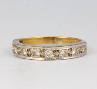 An 18ct yellow gold 9 stone diamond ring size L 1/2