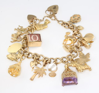 A 9ct yellow gold charm bracelet with 9ct, 14ct and unmarked gold charms, gross 49.42 grams