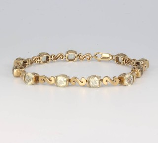A 9ct yellow gold gem set bracelet 