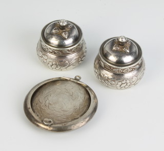 A silver compact Birmingham 1916, 2 repousse pots and covers, 53 grams