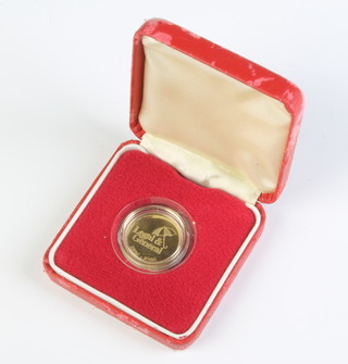 A 9ct yellow gold Legal and General commemorative medallion, 7 grams 