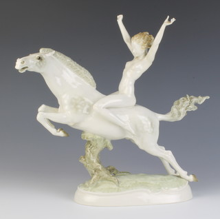 A Hutschenreuther figure of a naked lady riding a stallion, printed marks, 32cm 