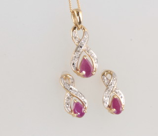 A 9ct yellow gold gem set pendant on a 9ct chain with en suite earrings