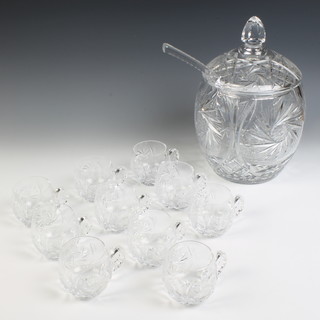 A Bohemian cut glass punch bowl and cover with ladle and 10 cups 
