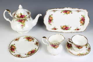 A Royal Albert Old Country Roses tea set comprising tea cup and cake plate, 8 tea cups, 8 saucers, 1 tea pot, 2 milk jugs, 2 sugar bowls, rectangular dish, 12 small plates, 6 medium plates 