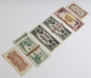 A quantity of uncirculated Japanese "Invasion Money" notes from Malaya, Borneo and Burma consisting of Malaya and Borneo - Five Cents (18) Ten Cents (10) Fifty Cents, (17) One Dollar (11)  Five Dollars (1) Ten Dollars (9) Burma - One Cent(15) and One Rupee (10)